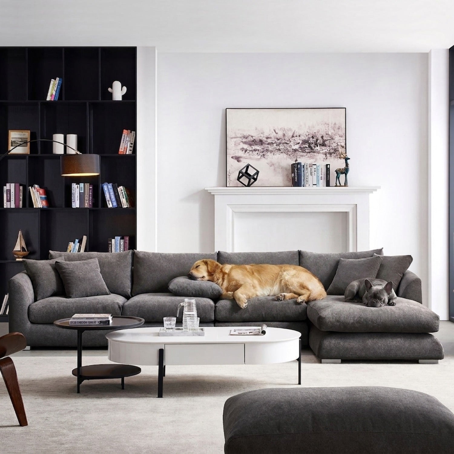Grey Feathers Sectional sofa in a living room with a black bookshelf and white fireplace