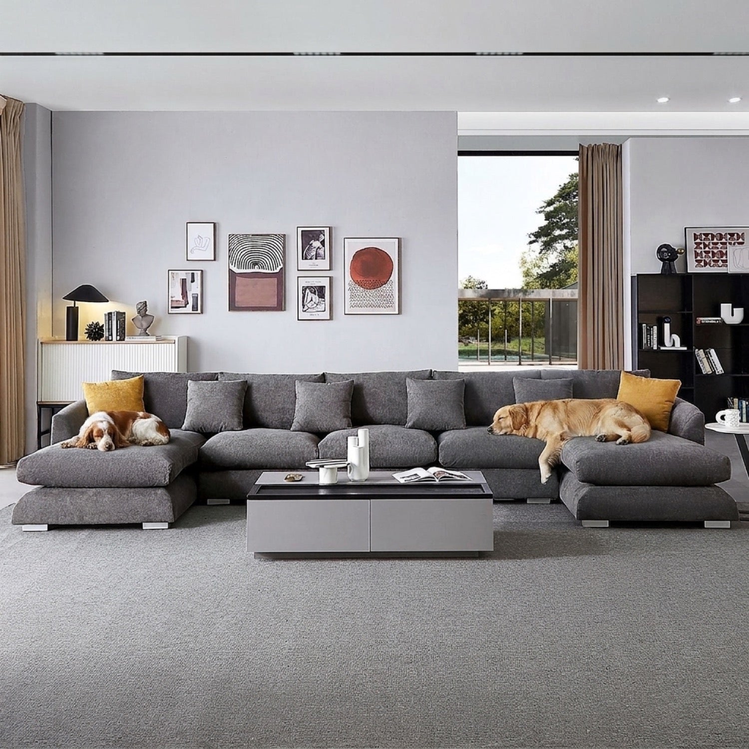 Grey U-sectional sofa with yellow throw pillows in a modern living room with a dog and two cats