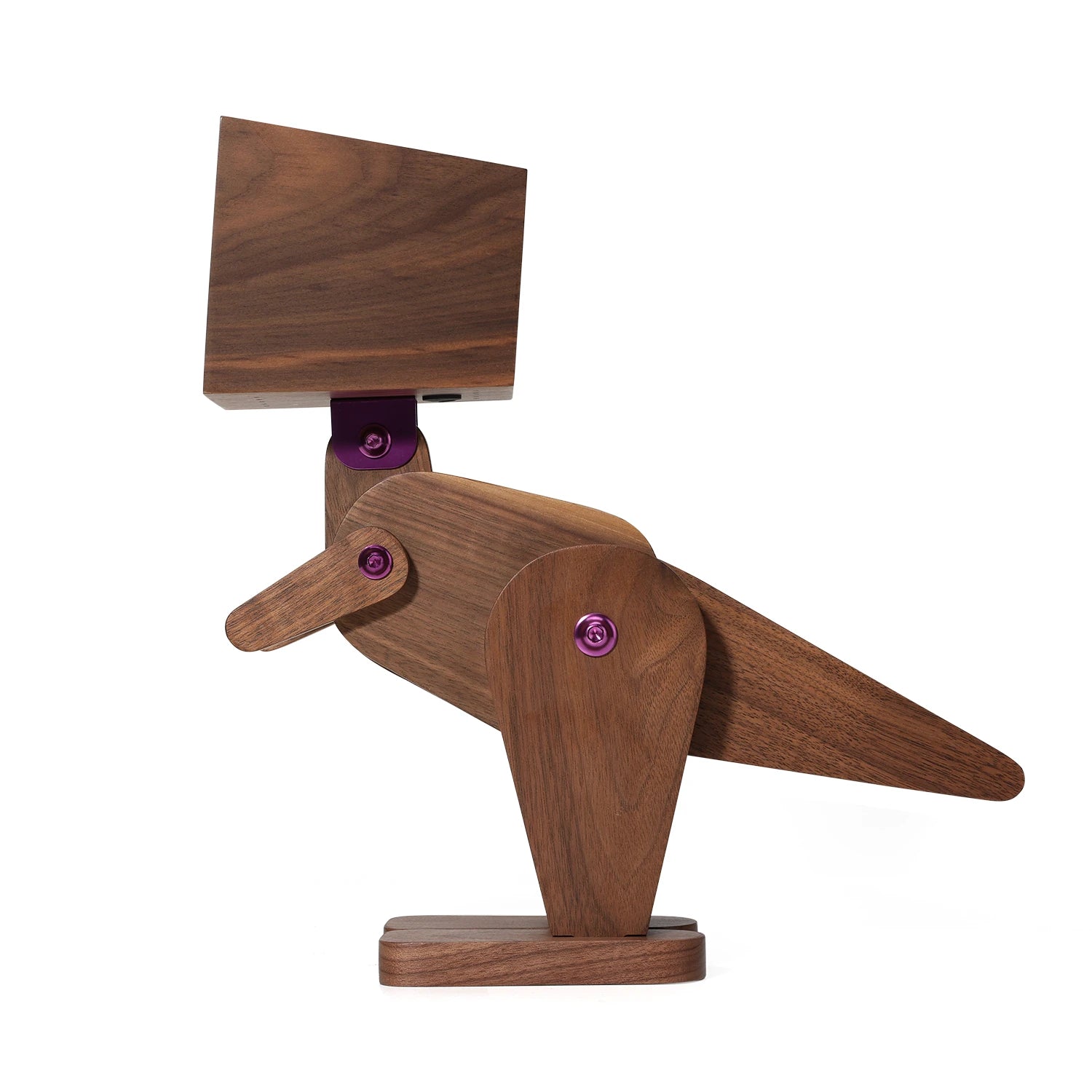 Wooden bird-shaped object with a purple component on a white background