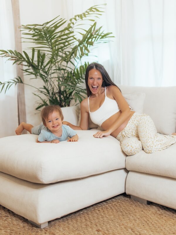 A parent and toddler enjoying time together on a Valyou sofa