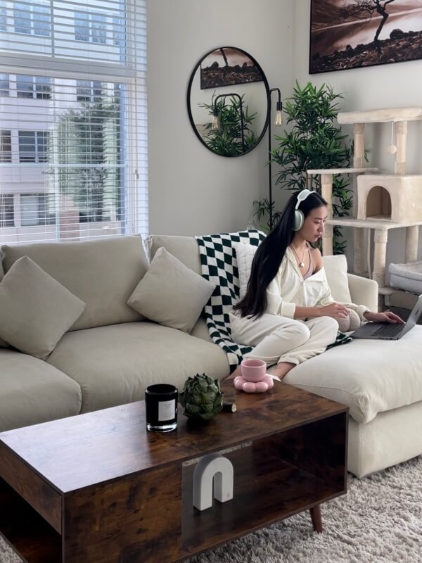 A person working comfortably from a Valyou sofa at home