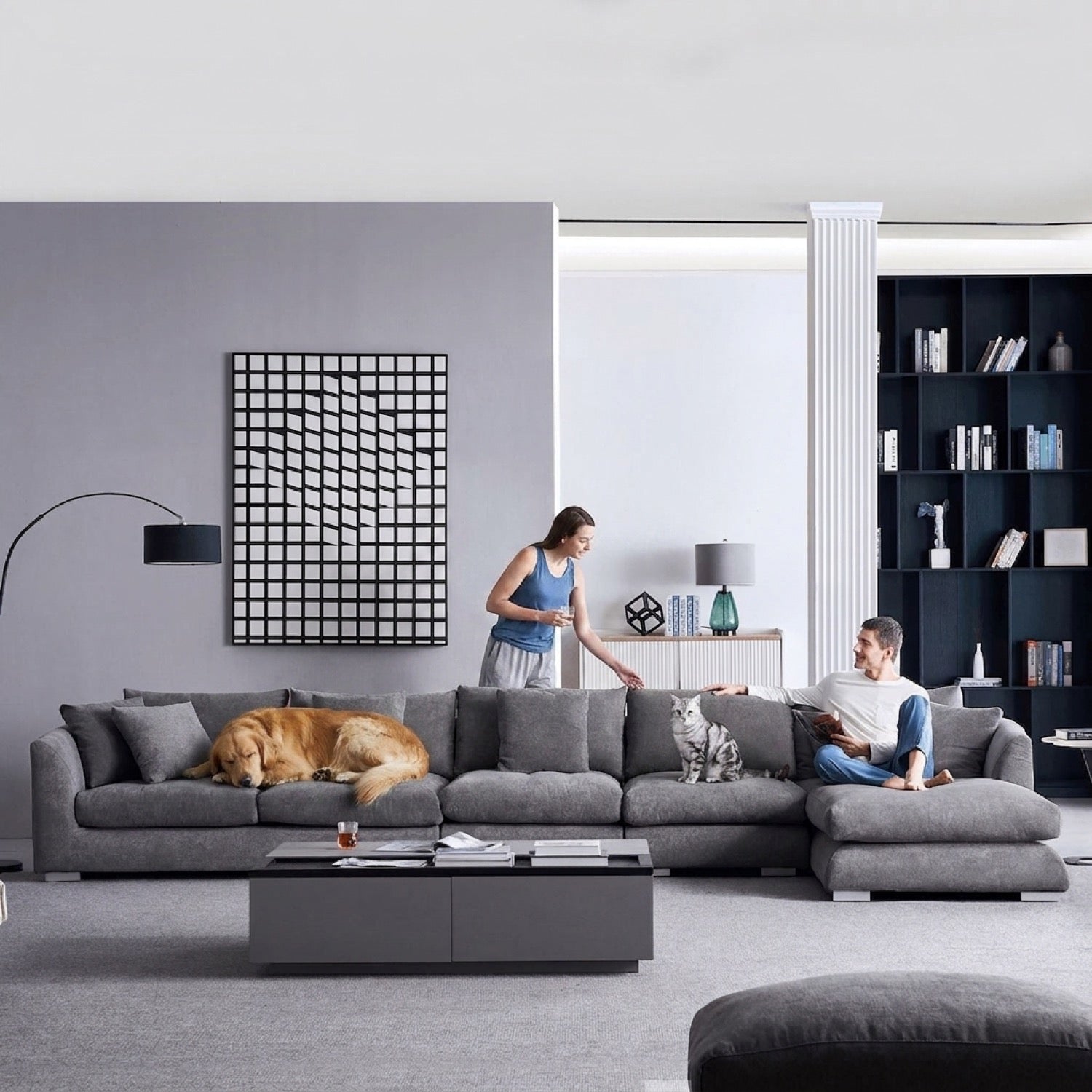 Grey Feathers Sectional sofa in a modern living room with a dog and cat, and two people relaxing